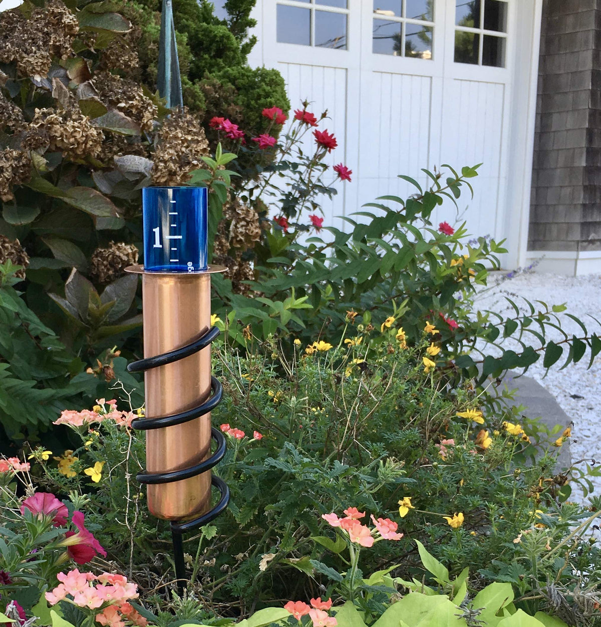 World's Coolest Rain Gauge Copper Finish ages with patina, enhancing outdoor style