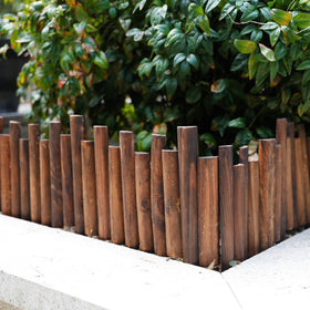 Worth Garden burnt wood finish blends rustic charm with landscapes.