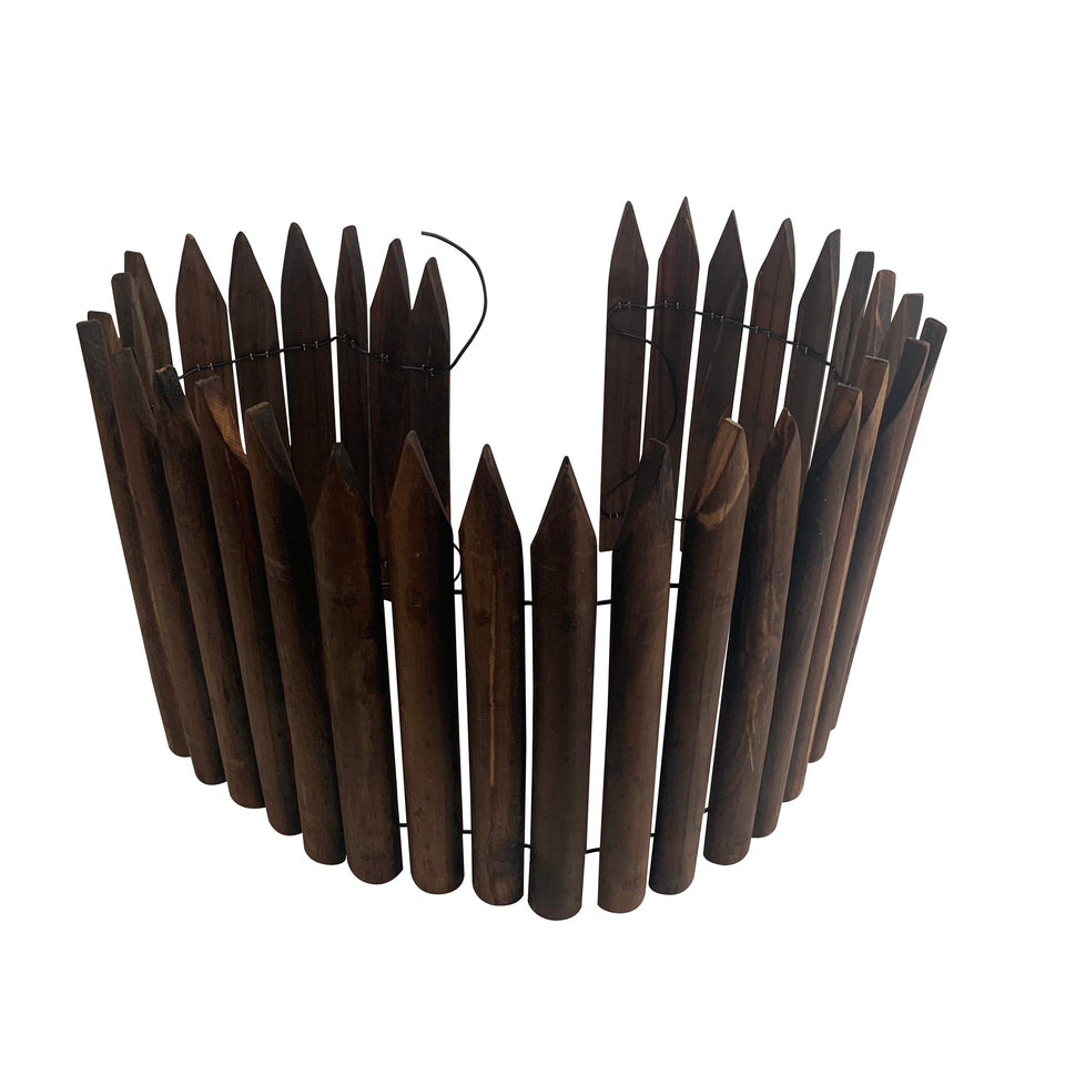 Worth Garden wooden short fence edging with burnt finish defining a flower bed.