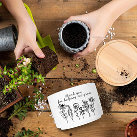 WSLCHOVE white ceramic flower pot adds a clean modern touch.