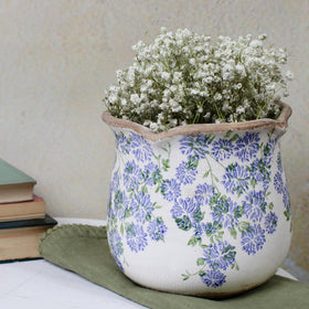 Xiaan Jiaju Antique Blue Meadow planter adds rustic charm to any room.
