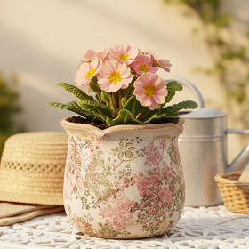 Xiaan Jiaju crackle glaze finish planter enhances pastel meadow décor for cozy living spaces.