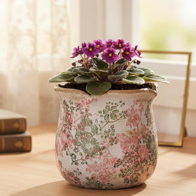 Xiaan Jiaju distressed-pattern planter adds vintage charm to any room.