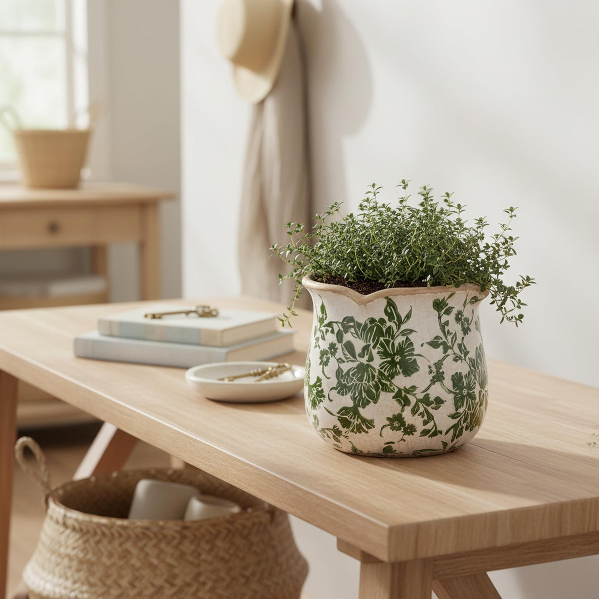 Xiaan Jiaju Tuscan ceramic plant pot pairs with foliage for vibrant displays.