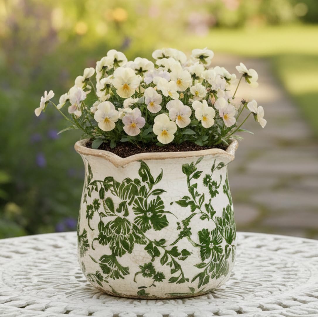 Xiaan Jiaju Tuscan ceramic plant pot with vintage glaze adds rustic charm.
