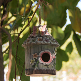 Xintim weatherproof resin bird house, durable in all weather.