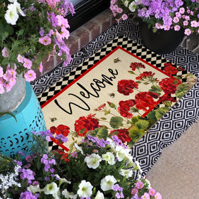 Xsinufn outdoor-indoor doormat with geranium-bee-red-floral buffalo-plaid stays in place.