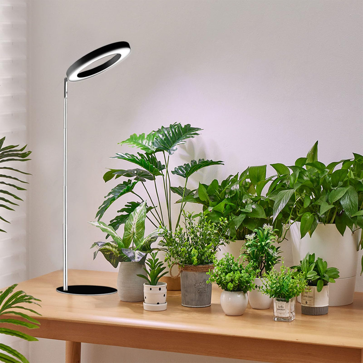 Yadoker 72-LED full spectrum grow light on a desk supports indoor herb growth.