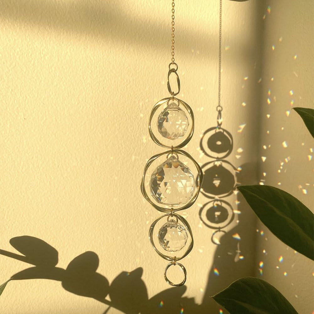 Yajuo prism suncatcher projects sunlight into a vivid wall rainbow.