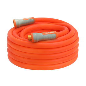 YAMATIC heavy duty garden hose with swivel fittings in use for yard irrigation.