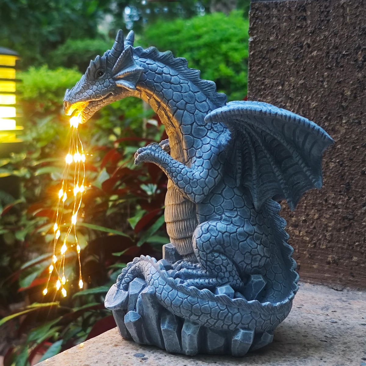 Yardancer dragon outdoor sculpture decorating a patio at dusk