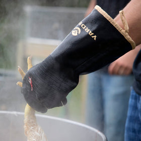 Yardbird extra-long cuffs shown protecting forearms during scalding and prep.