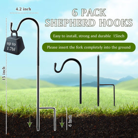 Yetene outdoor hook with ground base supports lanterns and wind chimes.