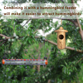 Yewacne hummingbird house adds garden charm while supporting birds in view.