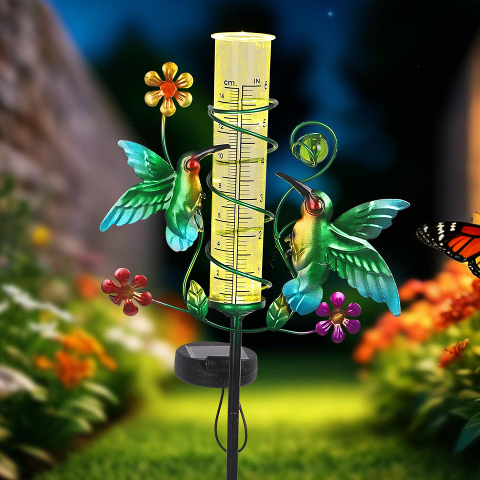 YHSOLAR hummingbird rain gauge stake in sunny garden for rainfall monitoring.