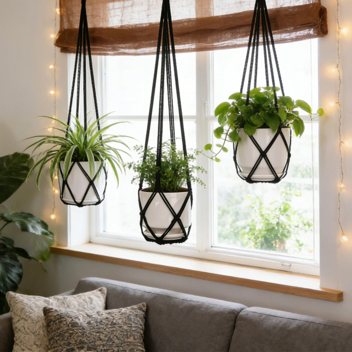 YIBOT macrame hanger supports indoor and outdoor plant displays.
