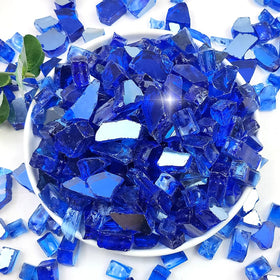 YISZM cobalt blue fire glass in a pit shows vivid reflections for outdoor gatherings.