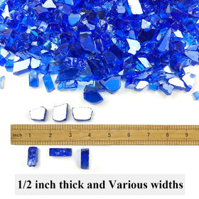 Closeup of YISZM cobalt blue fire glass shimmering with flames.