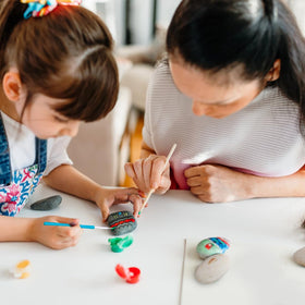 Gift-ready YISZM painting stones offering a creative experience