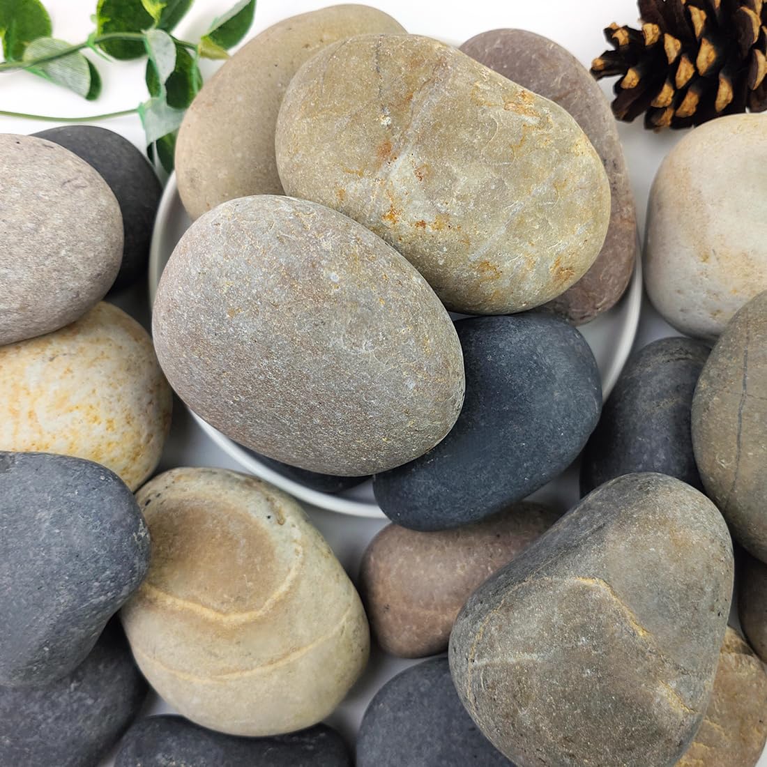 YISZM river rocks 3-4 inch collection adds natural color to gardens and pathways.