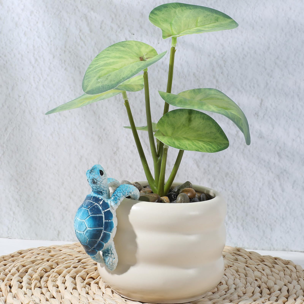 Yolev climbing tortoise statue brings whimsy to planters.