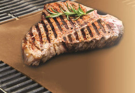 Yoshi Copper bake mat in oven; reusable, easy to wipe clean after baking.