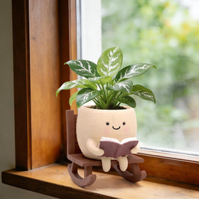 YOUOIVIA rocking chair book planter with smiley face, ideal for desk plant decor.