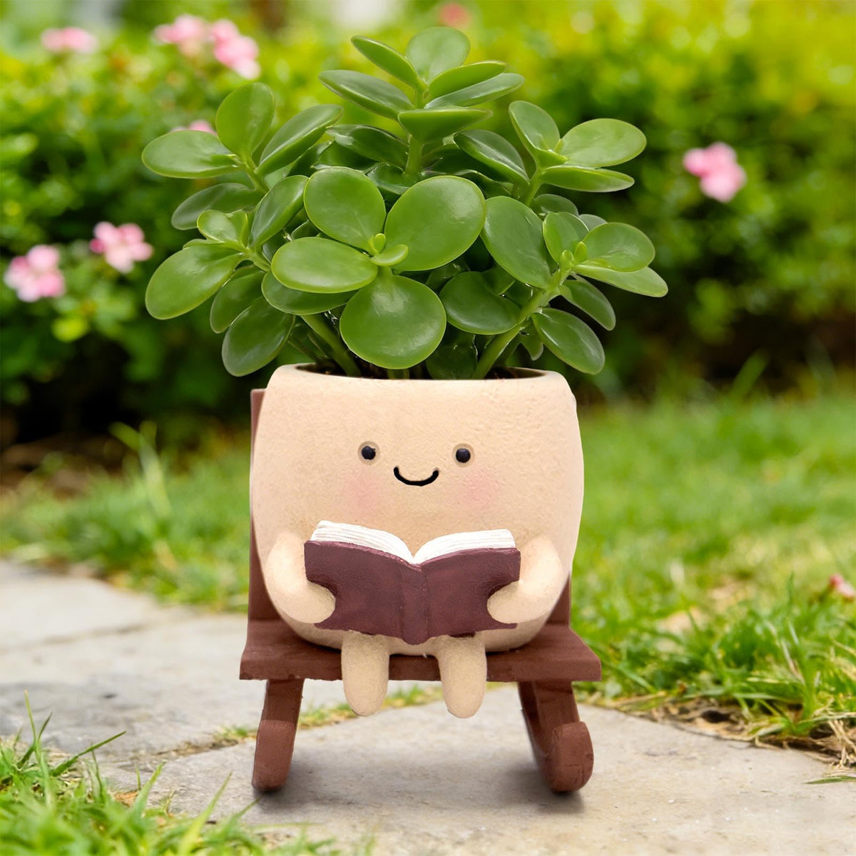 YOUOIVIA smiley-face planter on rocking chair for indoor or outdoor succulents.