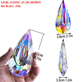 YU FENG AB-colored crystal suncatcher with dragon-eye shape reflecting light.