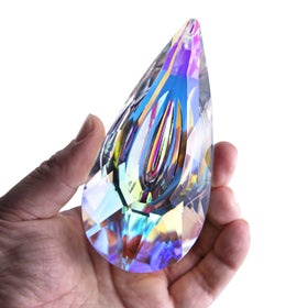 YU FENG crystal prism suncatcher in a sunny window creating rainbows.