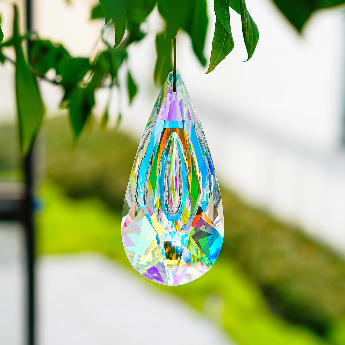 YU FENG window hanging crystal decor brightens a garden doorway.