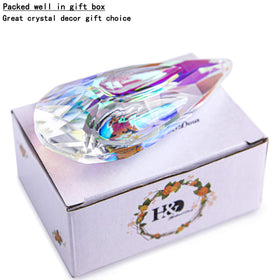 YU FENG hanging prism decor swirls colors across walls.