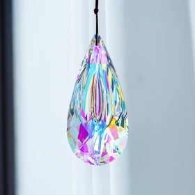 YU FENG crystal suncatcher on Christmas tree adds sparkle.