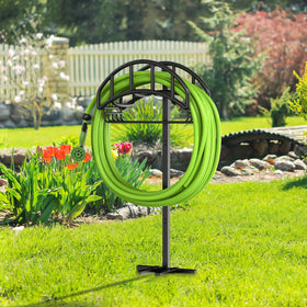 Outdoor yard hose organization with Yumatum hose storage system.