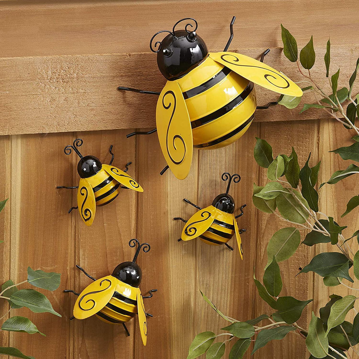 Yungeln small metal bee wall art adds subtle garden charm.