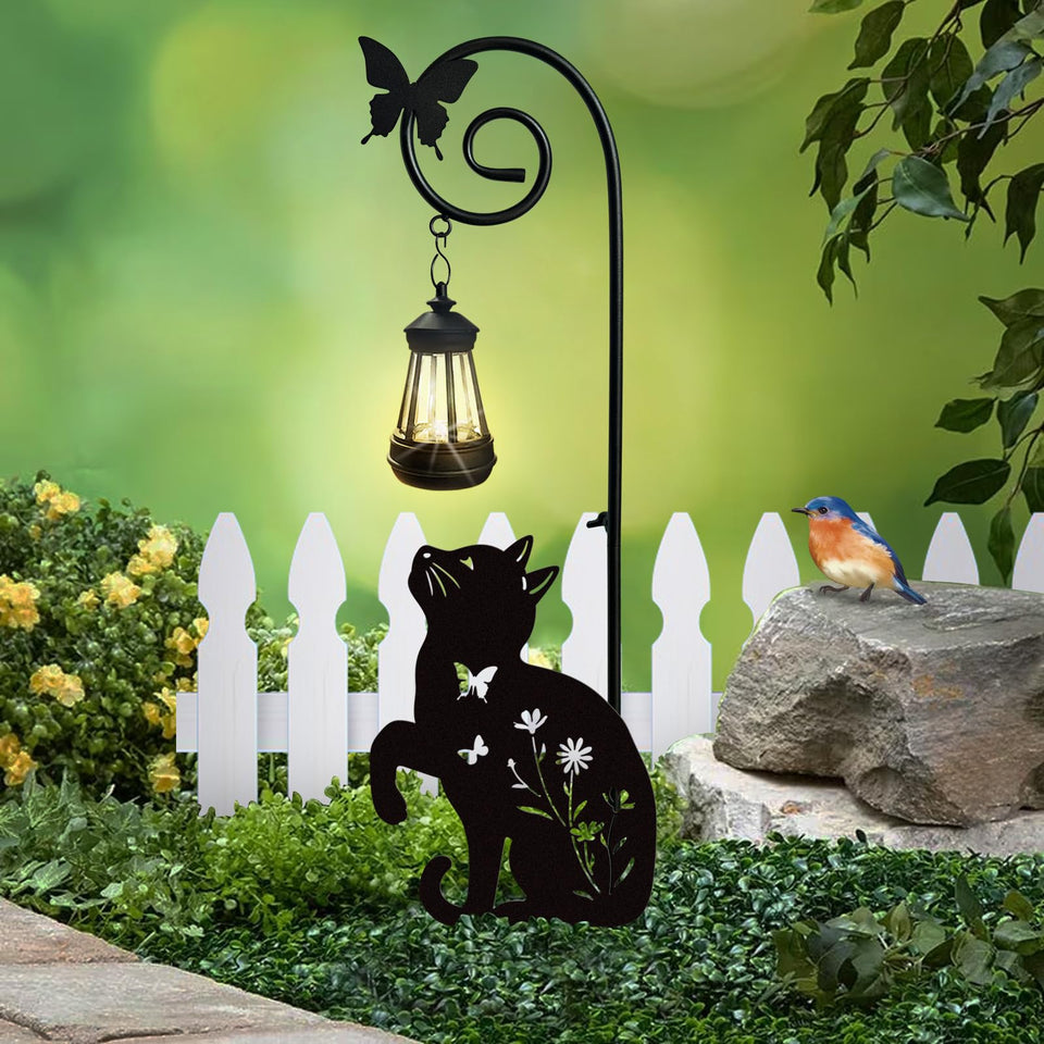 YY Gardenia metal cat stake with solar lights illuminating walkways at night.