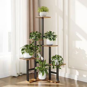 Yzosvki corner plant stand used for photos or decor items.