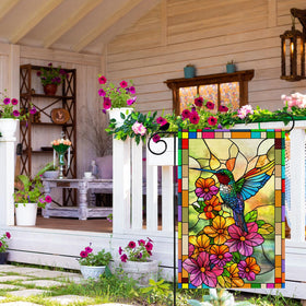ZAEW flag in garden adds colorful focal point.