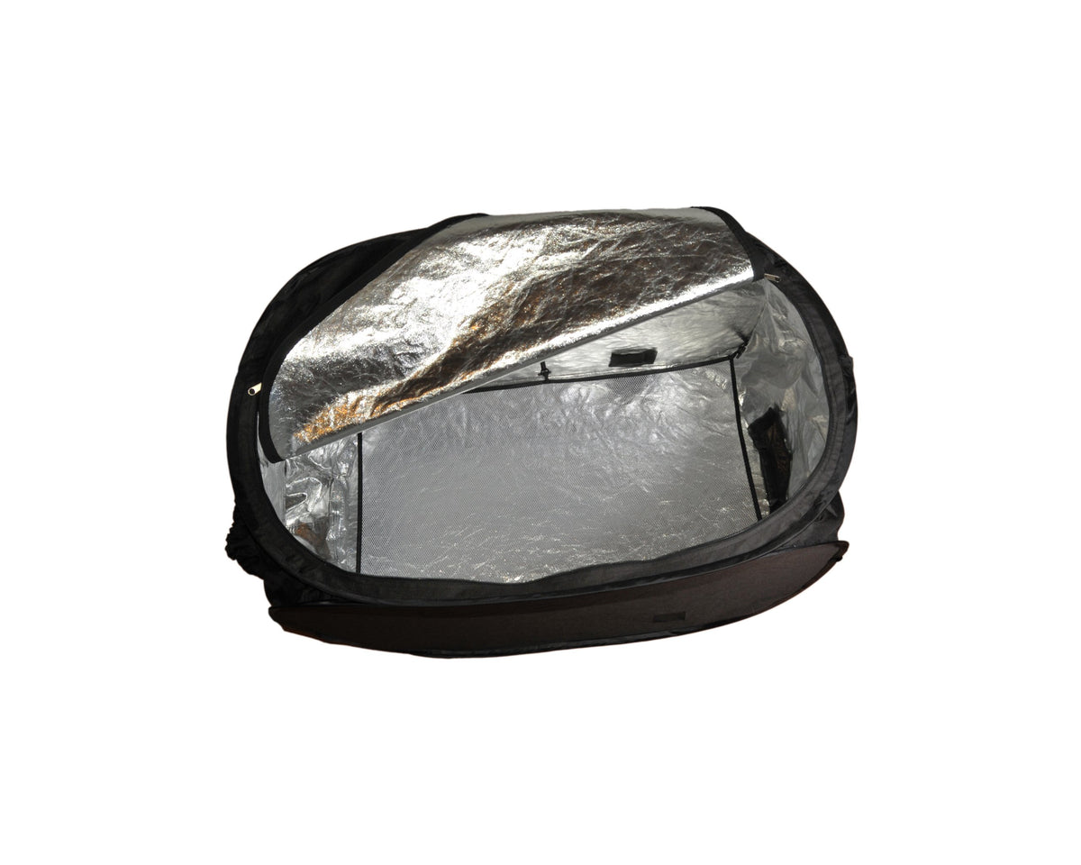 ZappBug heater in use with luggage and gear for bed bug treatment.