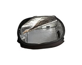 ZappBug heater in use with luggage and gear for bed bug treatment.