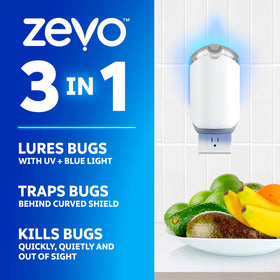 ZEVO flying insect trap plugged in beside a countertop for mess-free capture.